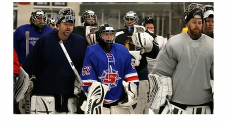 Mike from Wolf & Crown on the left with his mask up.  Photo from nhl.com
